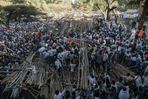 Hundreds had been sitting on a tiered wooden structure for hours when it collapsed