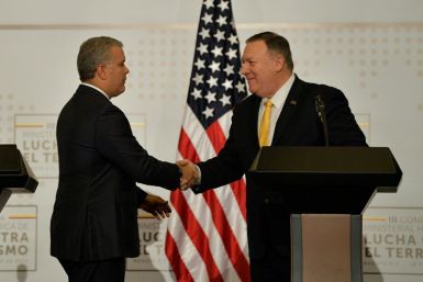 US Secretary of State Mike Pompeo (right) shakes hands with Colombia President Ivan Duque as the two meet in Bogota to discuss the humanitarian crisis in Venezuela