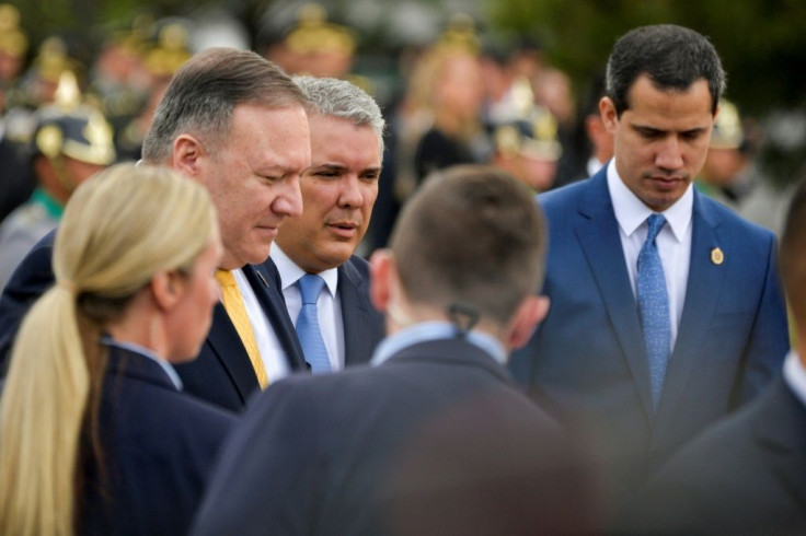 US Secretary of State Mike Pompeo (L), Colombian President Ivan Duque (C) and Venezuelan opposition leader Juan Guaido walk together in Bogota at a regional summit on terrorism