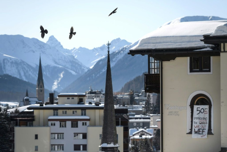 The four-day meeting of the world's top political and business leaders gets underway seeking to meet head-on the dangers to both the environment and economy from the heating of the planet