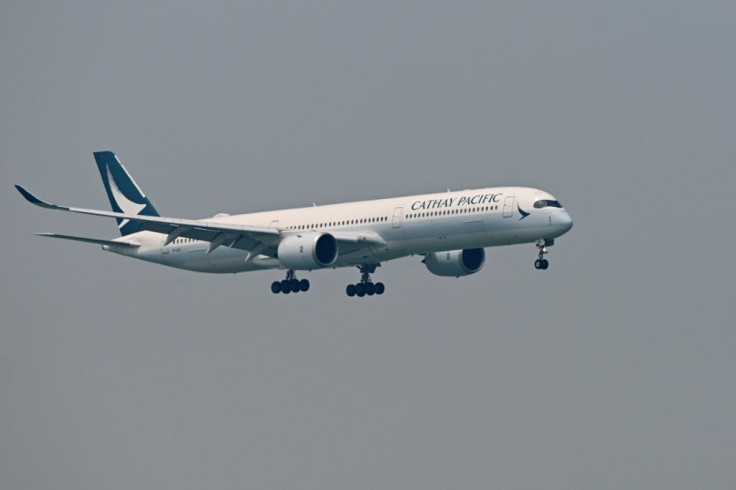 Shares in airlines including Cathay Pacific tumbled in Hong Kong, with the Hang Seng Index hit by worries about the SARS-like virus in China and Moody's downgrade of the city's credit rating