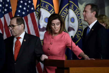Speaker of the House Nancy Pelosi, flanked by Impeachment Managers Rep. Adam Schiff (R) and Rep. Jerry Nadler, leaves a press conference after annoncing the impeachment managers on Capitol Hill January 15, 2020