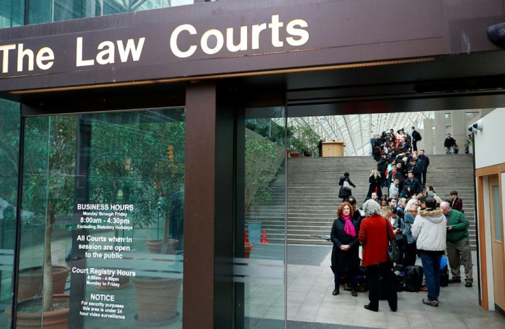 Members of the media and public line up outside a British Columbia Supreme courtroom on the first day of the extradition trial for Huawei Technologies Chief Financial Officer Meng Wanzhou on January 20, 2020 in Vancouver, Canada.