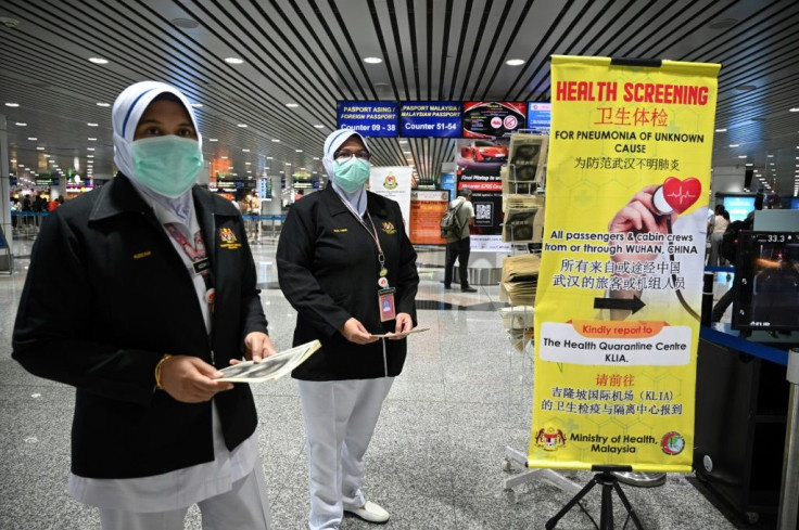 Malaysian health officers are deployed at Kuala Lumpur International Airport in Sepang on January 21, 2020