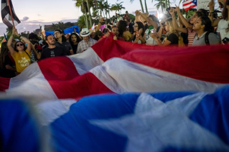 Protesters gather in front of Puerto Rico's Capitol against Governor Wanda Vazquez Garced and the government in San Juan after discovery of a warehouse filled with unused emergency supplies dating from Hurricane Maria in 2017