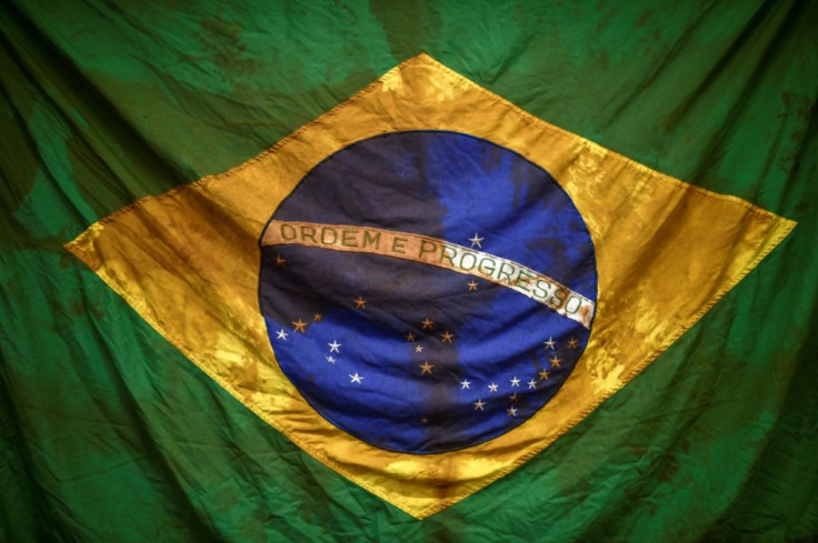 This Brazilian flag was found by firefighters searching through the mud for survivors in the days after the 2019 Brumadinho dam collapse; 11 people are still missing