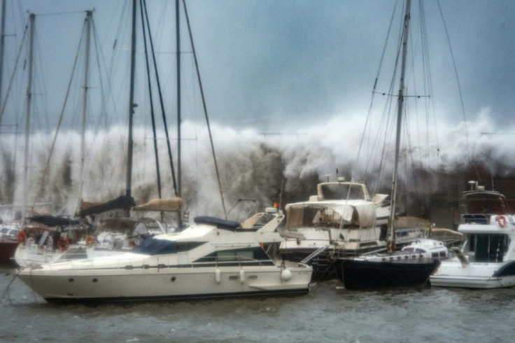 Waves broke over a sea wall at the Port Olympic marina in Barcelona as storm Gloria battered the Spanish eastern coast earlier this week