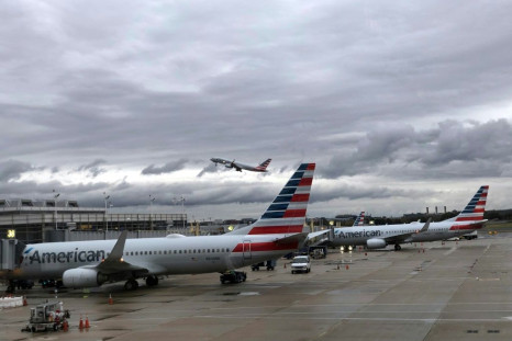 American Airlines reported a jump in fourth-quarter profits on continued strong consumer demand that offset the hit from the 737 MAX grounding