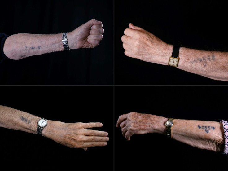 Holocaust survivors show Auschwitz prison numbers on their arms