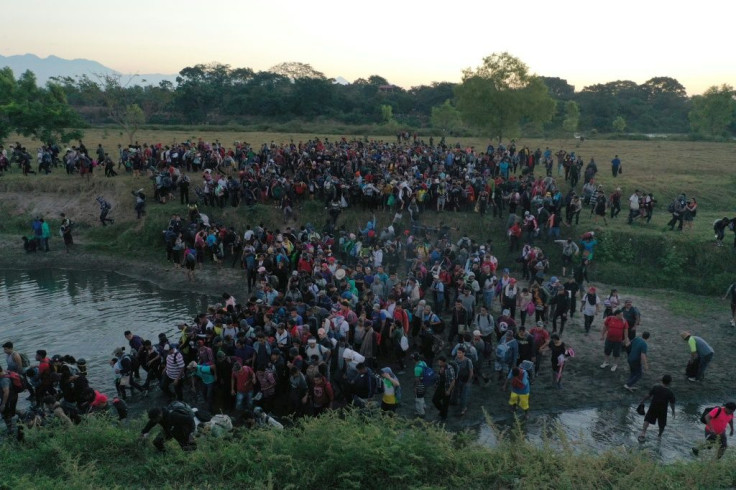 Central American migrants - mostly Hondurans heading in a caravan to the US - crossing the Suchiate River from Guatelmala into Mexico