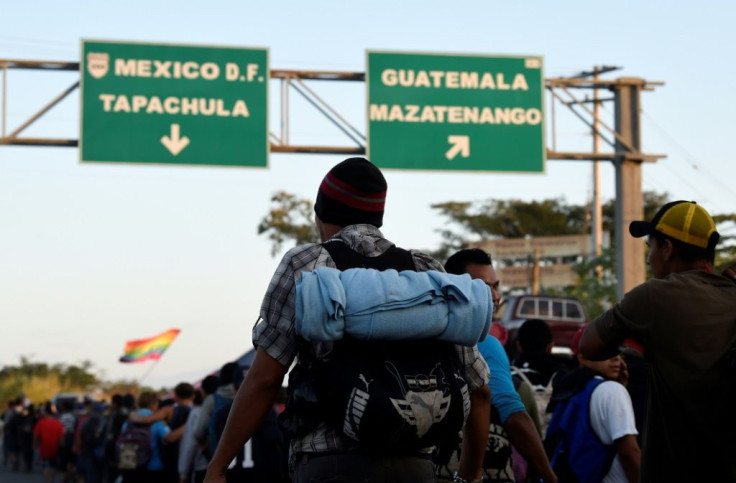 Migrants walking on the outskirts of Ciudad Hidalgo in Mexico's southern Chiapas State, after crossing the border from Guatemala