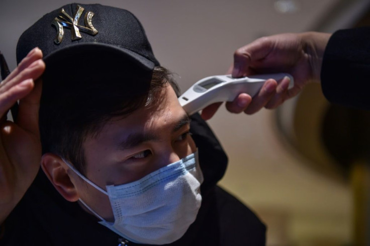 The National Health Commission said authorities were examining 1,072 suspected cases of the virus that first emerged in central city of Wuhan
