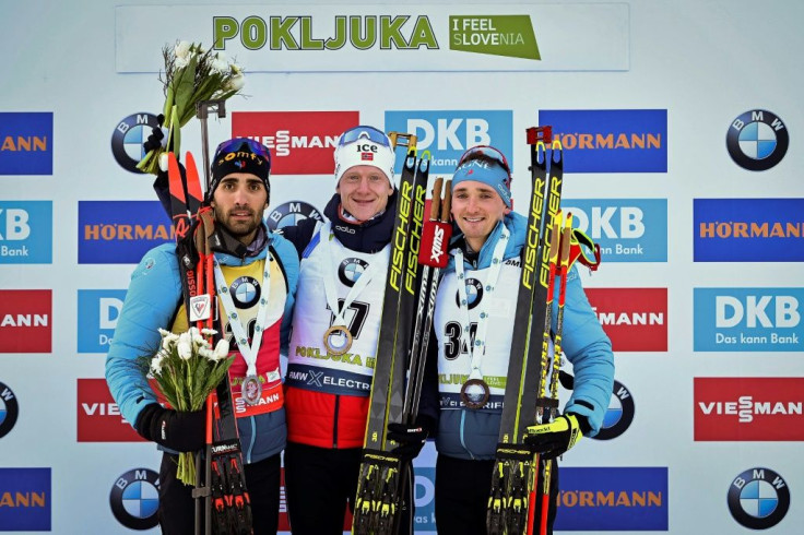 'This podium is for him, I am sure he is proud of us,' French biathlete Fabien Claude (R) said of his missing father, Gilles Claude, after winning a bronze medal at Thursday's Biathlon World Cup in Slovenia