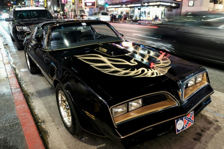 A Pontiac Firebird Trans Am that once belonged to late Hollywood star Burt Reynolds was among the luxury items seized from a husband and wife team charged in a solar power investment scam