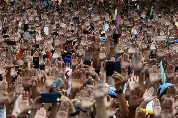 People attend a rally against President Nicolas Maduro in Caracas in January 2019