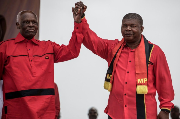 Happier times: Dos Santos and Lourenco, his hand-picked successor, at a rally in Luanda in August 2017