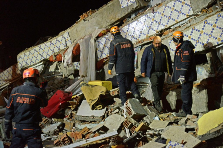 Rescue teams searched through the night for survivors trapped in the rubble of a collapsed building