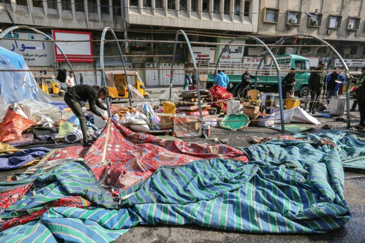 Demonstrators in Baghdad's Tahrir (Liberation) Square dismantle their long-running protest camp