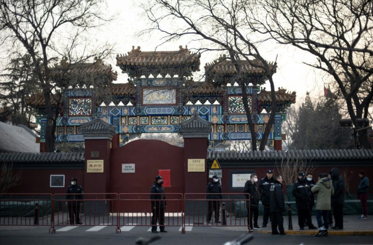 Security guards loitered in front of Beijing's Lama Temple on Lunar New Year, shooing away anyone who lingered for too long