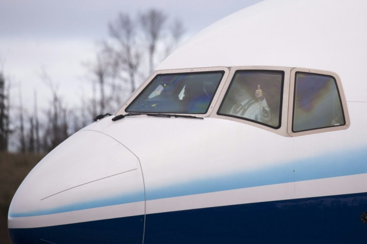 A pilot gives a thumbs up as he taxis a Boeing 777X airplane before taking off on its inaugural flight at Paine Field in Everett, Washington in the United States on January 25, 2020