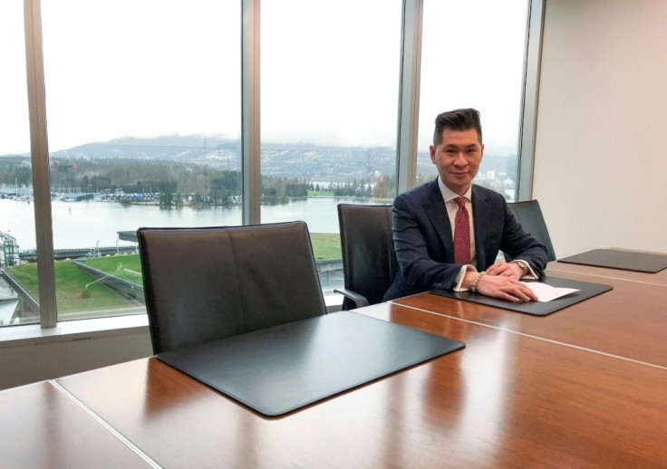 Canadian lawyer and royal commentator Edward Wang talks to AFP in his office overlooking Vancouver harbor on January 24, 2020