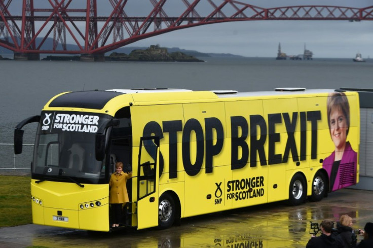 Scotland's First Minister Nicola Sturgeon poses on the steps of the Scotland National Party (SNP) campaign bus
