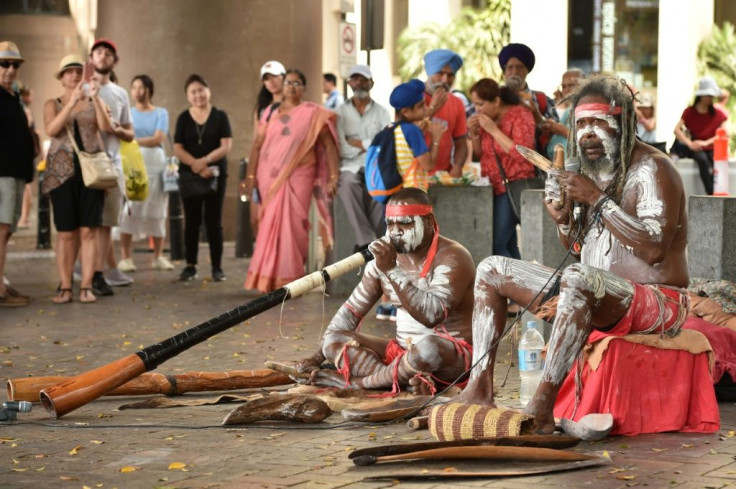 Indigenous Australians performing in Sydney on Australia Day, which celebrates the origins of the modern nation. Many indiginous Australians, however, mark the day with mourning