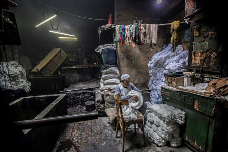 Salama Mahmoud Salama, 83, in his traditional hand-dying workshop in Cairo's centuries-old Darb al-Ahmar district