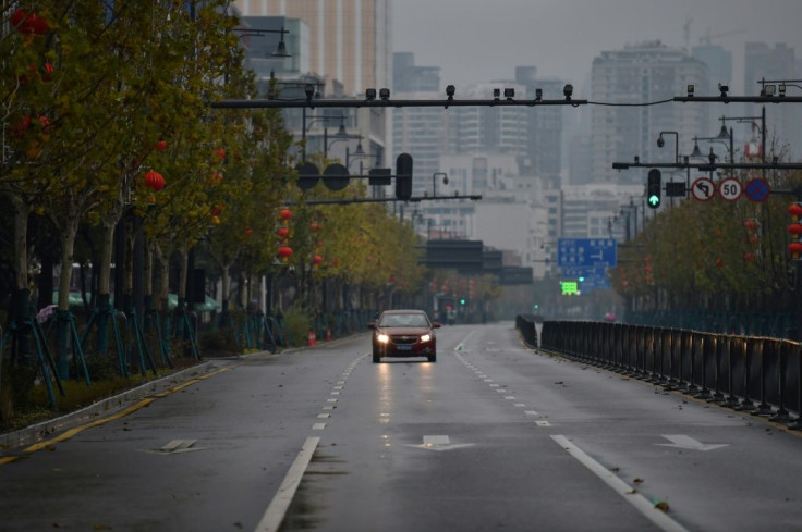 Wuhan's public transport system has been halted, taxi services curtailed and new restrictions introduced banning most cars from the streets