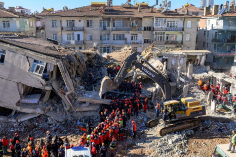 Nearly 4,000 rescue workers combed through debris in freezing temperatures, helped by mechanical diggers, in vain hopes of finding anyone alive