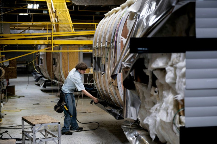 A worker assembles a camping trailer at the Riverside RV factory in Indiana -- experts consider recreational vehicles to be bellwethers of the American economy