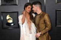 Actress Priyanka Chopra (L) and her singer-songwriter husband Nick Jonas were steamy on the Grammys red carpet