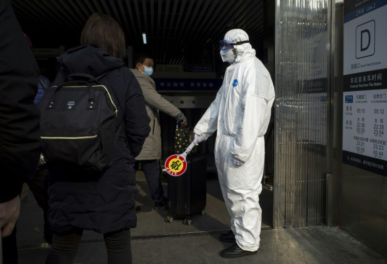Security personnel in China are wearing protective clothing as they to help stop of the deadly virus