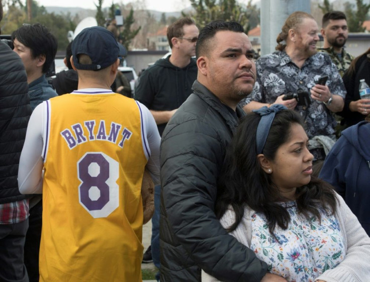 People gather near the scene of a helicopter crash in Calabasas on Sunday, January 26, 2020 that killed 9 people including Los Angeles Laker star Kobe Bryant and his daughter Gianna