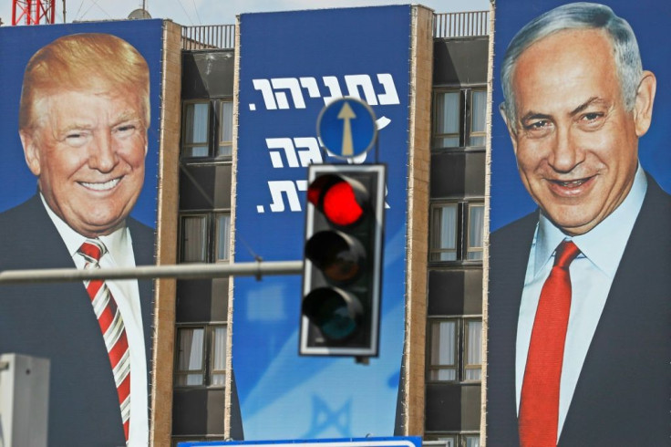 This picture taken on September 14, 2019 shows an Israeli election banner bearing the portraits of US President Donald Trump (L) and Prime Minister Benjamin Netanyahu hanging on a building facade in Jerusalem