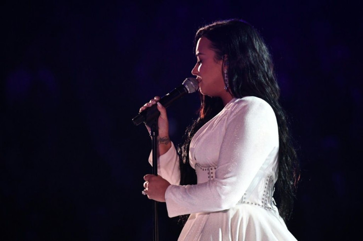 Demi Lovato -- in a stunning white Christian Siriano gown -- brought the Grammys audience to their feet with her raw performance