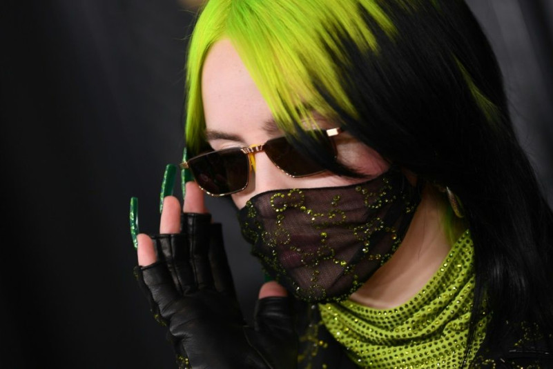 Billie Eilish embodies a style completely her own, pairing oversized ensembles with garish colors and ultra-long nails