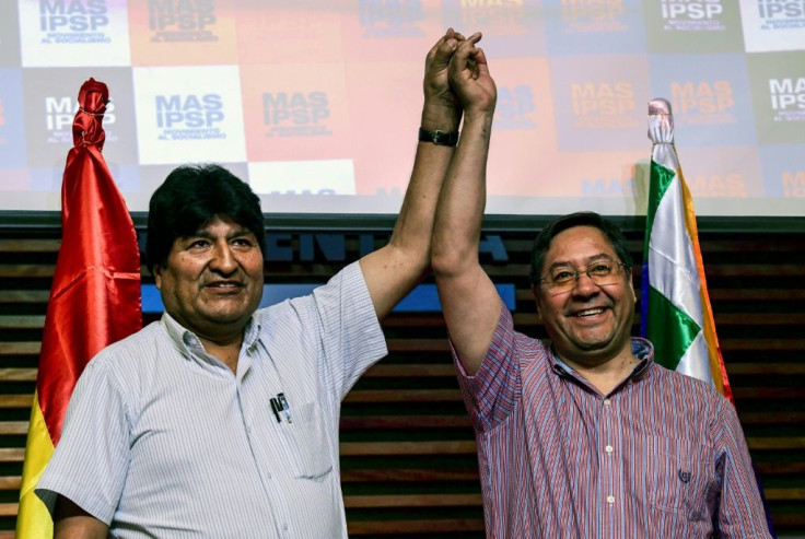 Bolivia's ex-President Evo Morales (L) and presidential candidate for his Movement for Socialism (MAS) party, Luis Arce, pose at a news conference in Buenos Aires