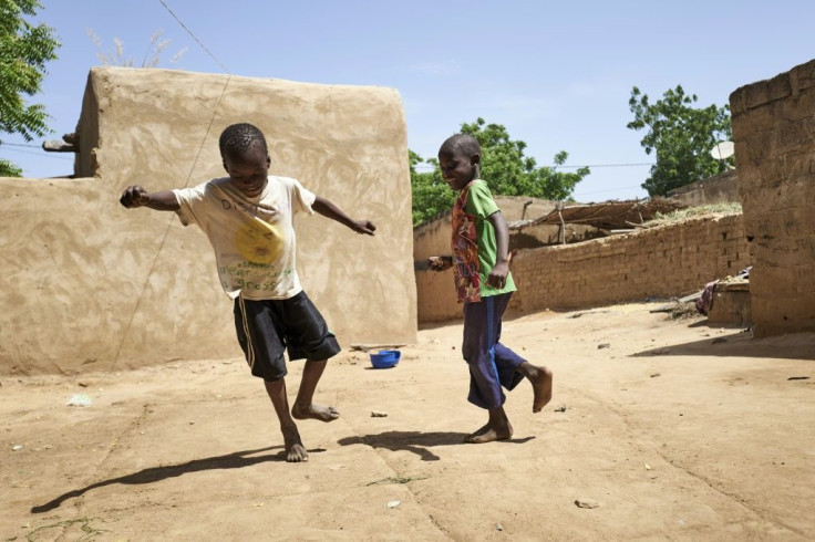 Two displaced children play in Mali, which has been wracked by an Islamist insurgency that has taken a brutal toll on the youth in the Sahel