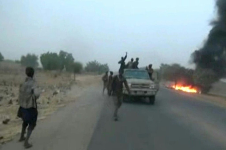 Dangerous roads: A screen grab from a January 2018 video released by Boko Haram, showing jihadists attacking the military on a highway near Maiduguri