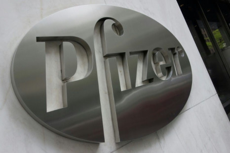 Pfizer reported a fourth-quarter loss on lower sales but said the company was on track to reengineer itself to focus on new game-changing pharmaceuticals