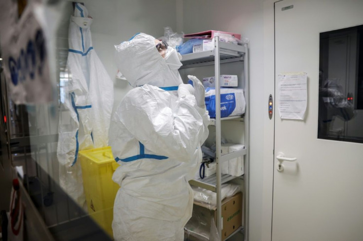 A laboratory operator puts on protective gear before handling patients' samples at the Institut Pasteur in Paris. More than 4,500 cases of coronavirus have been confirmed in China. Several cases have been detected in France, USA and elsewhere.