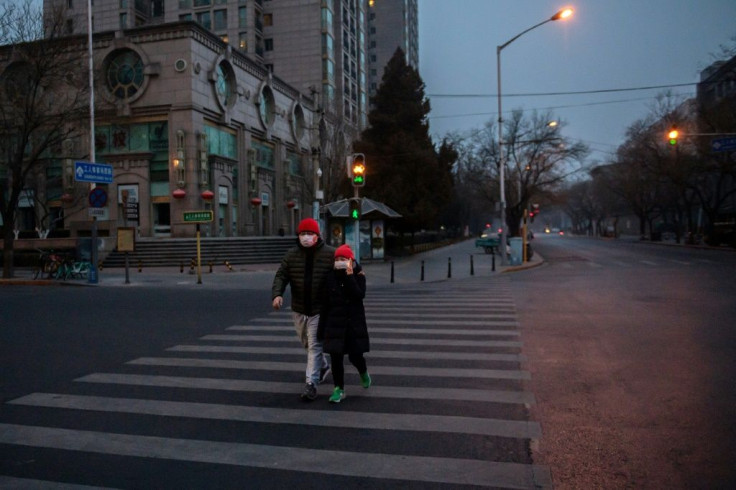 Many streets in Beijing are nearly empty amid fears over the coronavirus epidemic -- with the death toll soaring above 100, China and foreign governments are stepping up measures to try to contain it