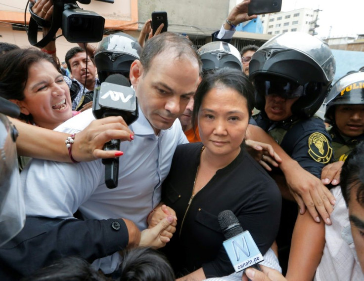 Keiko Fujimori arrives at a Lima courthouse with her husband Mark Villanella on Tuesday