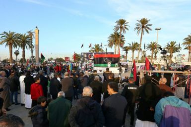 Libyans take part in a demonstration against eastern strongman Khalifa Haftar -- who is backed by France, Russia and others -- and in support of the UN-recognised Government of National Accord (GNA), at Martyrs' Square in the GNA-held capital Tripoli