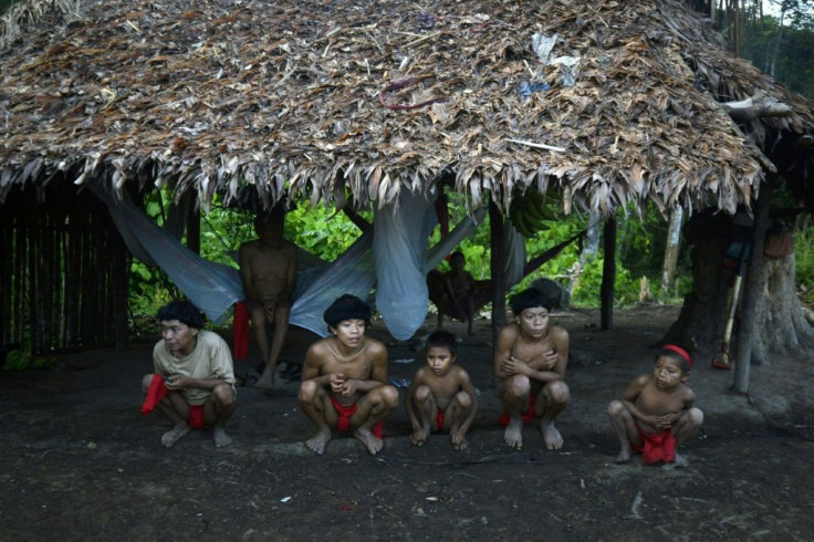 Yanomami natives in a hut in Amazonas state in southern Venezuela, 19 km from the border with Brazil, in September 2012