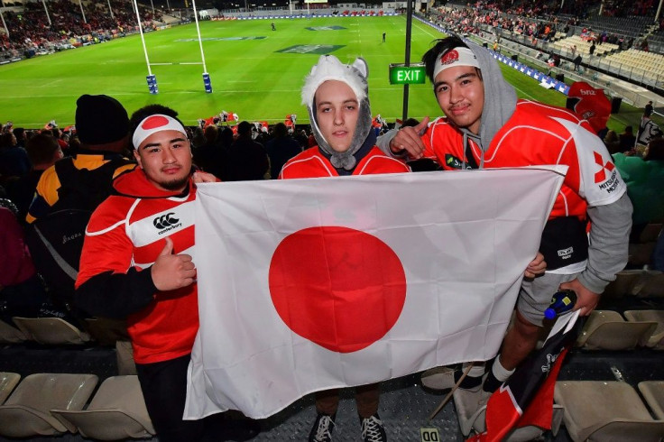 Sunset for Sunwolves: Japan fans hold a flag during a Sunwolves match in Christchurch. The Japan franchise will play their final Super Rugby season in 2020