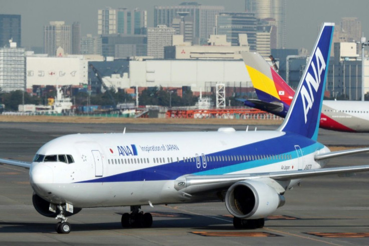 An All Nippon Airways plane lands at Haneda airport in Tokyo carrying a second batch of Japanese citizens evacuated from the Chinese city of Wuhan