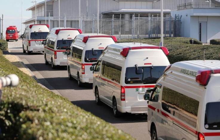 Ambulances arrive at Haneda airport in Tokyo to meet a second charter flight carrying Japanese citizens from the Chinese city of Wuhan