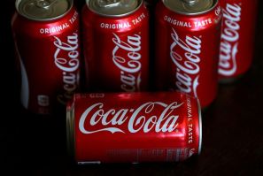Shares of Coca-Cola rose as it reported higher sales, with especially good growth in Asia and Latin America